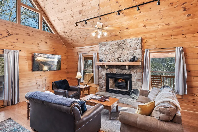 Cozy seating around the stone fireplace