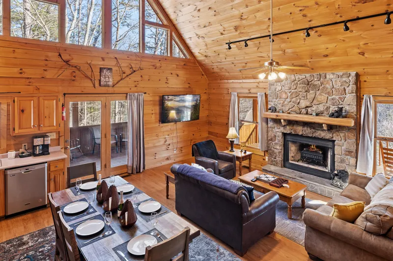 Great room with fireplace and dining table