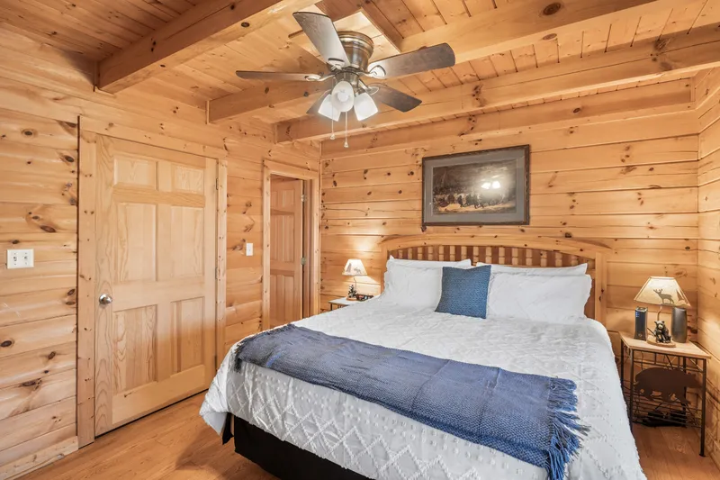 Lower-level king bedroom with blue accents