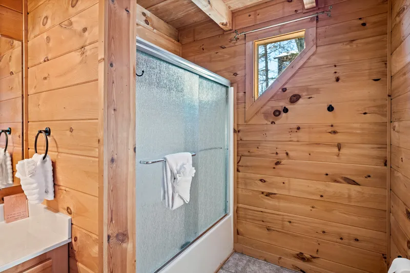 Bathtub and shower combo with glass doors